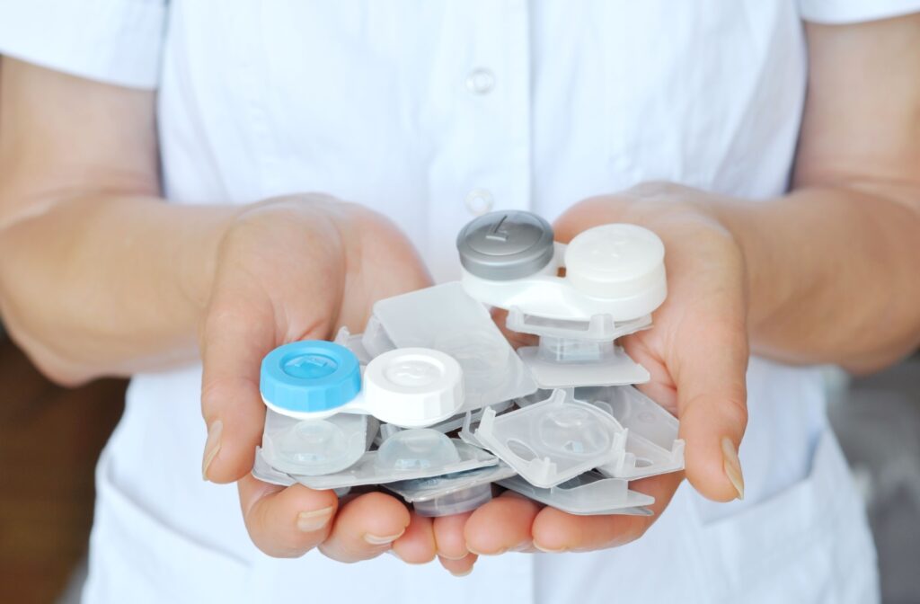 An optometrist holding a variety of different contact lenses.