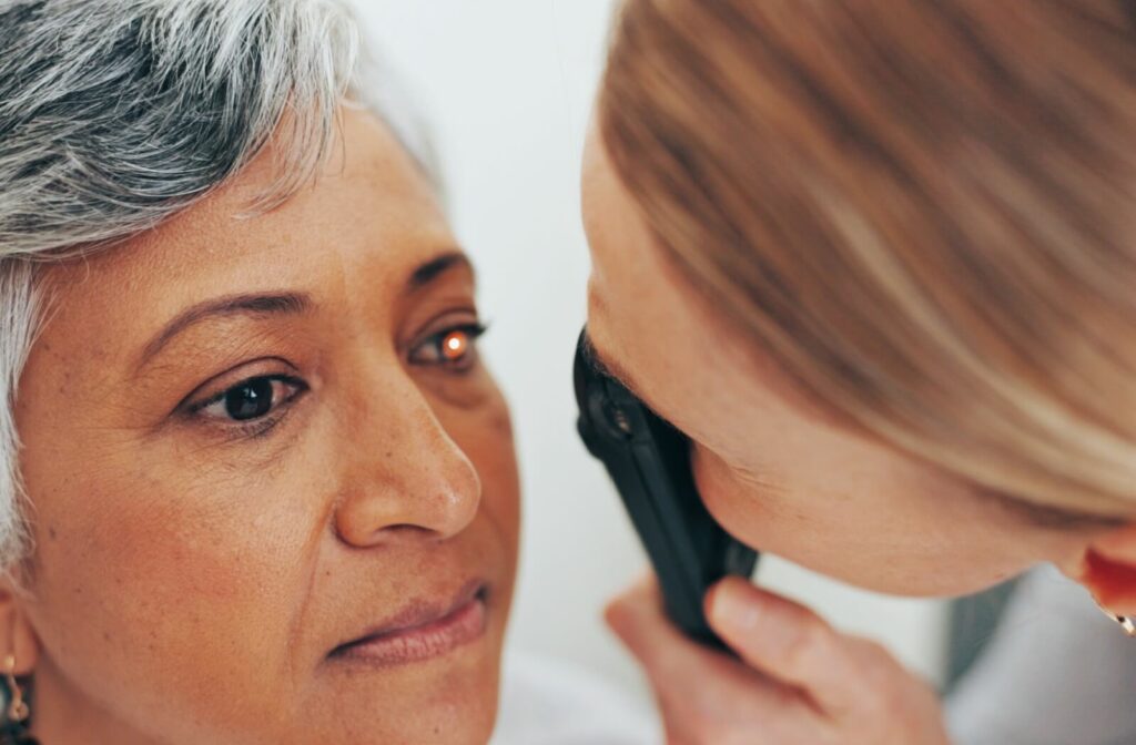 Optometrist examines a person’s eye during a close-up eye health assessment